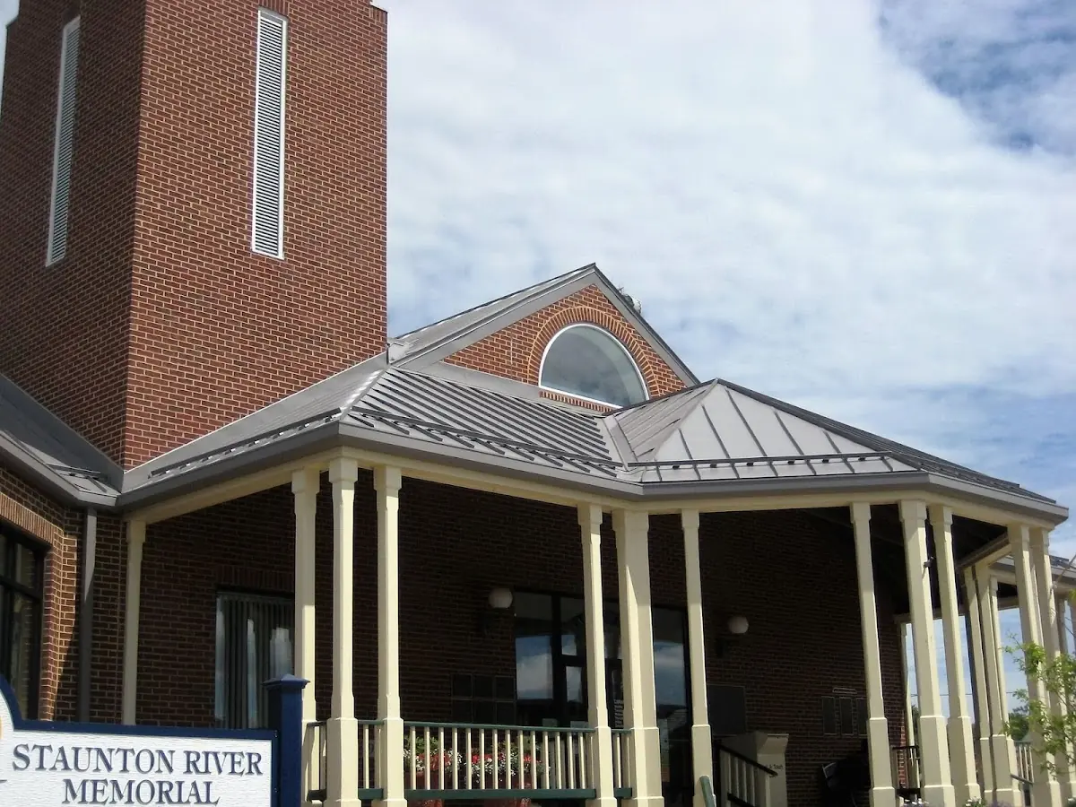Skilled roofing craftsmen working on a residential roof in Brandon